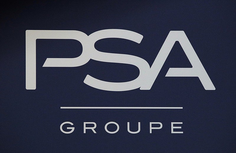 FILE - In this Thursday, Feb. 23, 2017, file photo, the logo of PSA Group is pictured in Paris. Italian-American carmaker Fiat Chrysler Shareholders of Fiat Chrysler and France's PSA Group are meeting Monday, Jan. 4, 2021 to vote on a merger that will create the world's fourth-largest automaker. The new company called Stellantis will be run by PSA CEO Carlos Tavares, who is known for cutting vehicles or ventures that don't make money. (AP Photo/Christophe Ena, File)