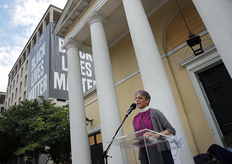 FILE - In this June 19, 2020 file photo, Rev. Mariann Budde, bishop of Washington’s Episcopal diocese, speaks during a service outside St. John's Episcopal Church near the White House in Washington. Budde is among more than 2,000 faith leaders and faith-based activists who signed a statement that is set to be released Monday, Jan. 4, 2021, urging members of Congress “to honor” the result of November’s election by avoiding “a delayed and drawn out objection” on Wednesday, Jan. 6 when President-elect Joe Biden’s win is set to be certified. (AP Photo/Carolyn Kaster, File)