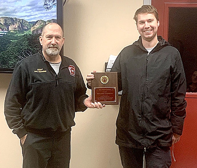 Pea Ridge Fire Chief Jack Wassman presented the awards for the Firefighter of the Year and the Responder of the Year to Ben Osowiecki Monday. Osowiecki responded to the most number of calls for 2020. He was voted on as Firefighter of the Year by the firefighters on the department.