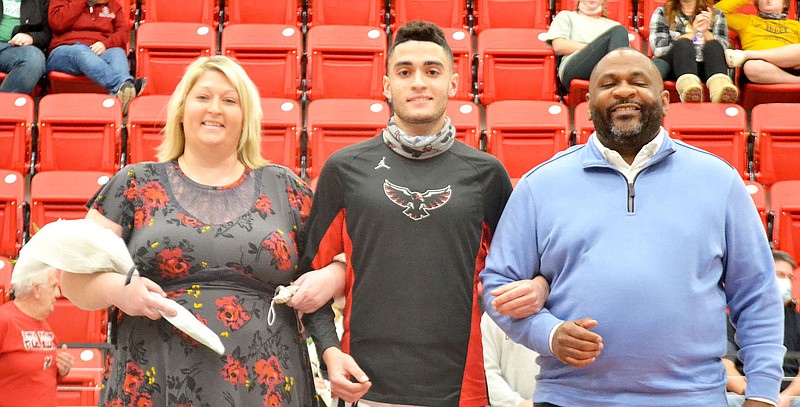 TIMES photograph by Annette Beard
No. 22 Malik Bagsby, escorted by his mother, Kimberly Walton, and father, Brandon Bagsby