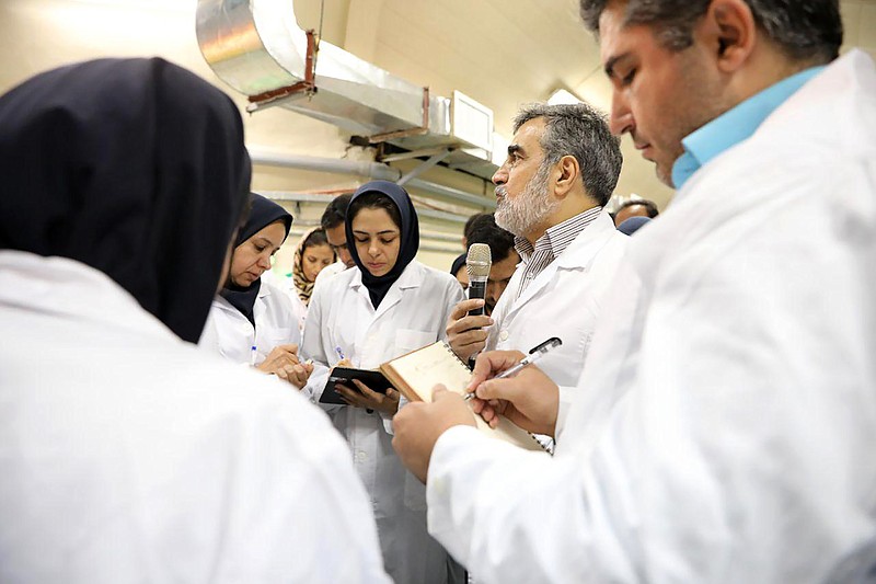 In this photo released by the Atomic Energy Organization of Iran, spokesman of the organization Behrouz Kamalvandi, center, briefs the media while visiting Fordo nuclear site near Qom, south of Tehran, Iran Saturday, Nov. 9, 2019. Joe Biden has an Iran problem. And, it’s getting more complicated by the day. Thanks to provocative moves by Iran and less-than-coherent actions by the outgoing Trump administration, the president-elect is facing an increasingly uncertain situation when it comes to Iran, a decades-long American nemesis that has been a target of blame for much of the Middle East's instability, (Atomic Energy Organization of Iran via AP)