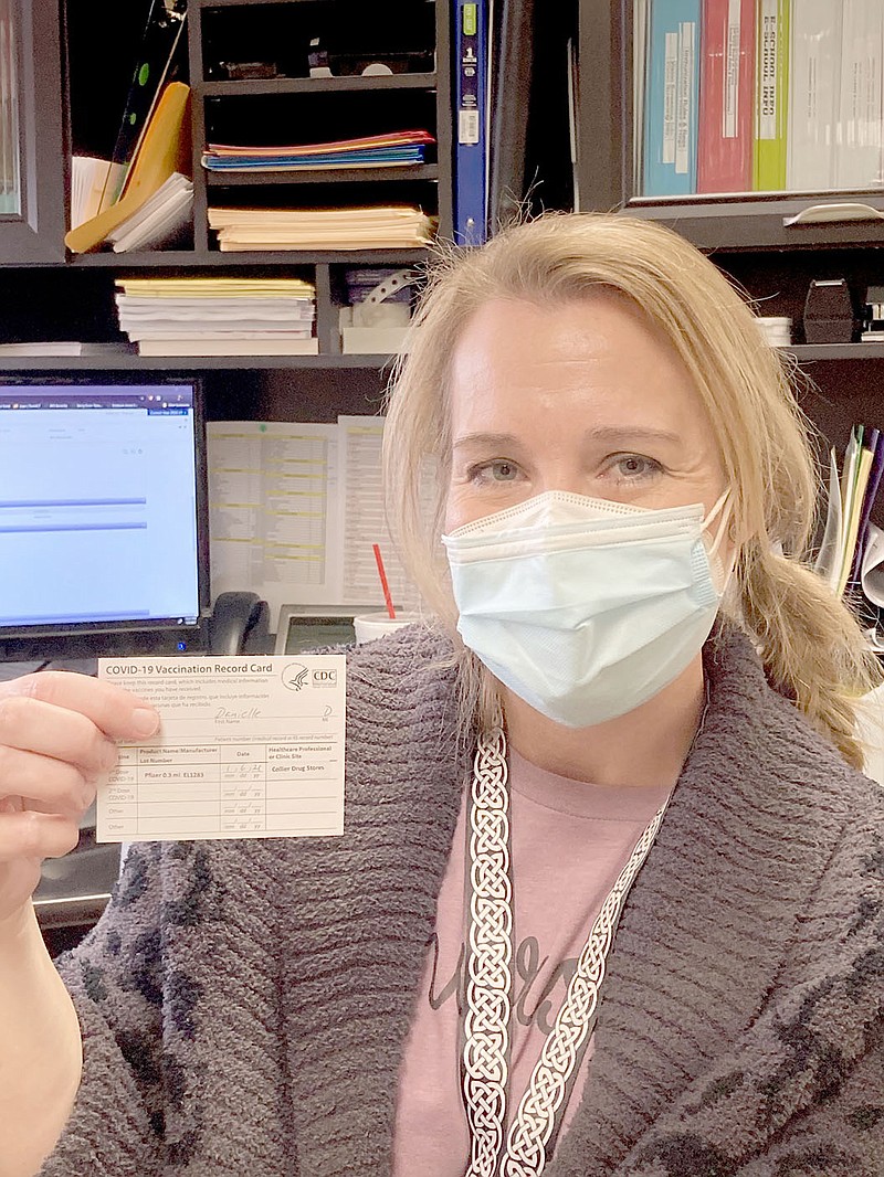 COURTESY PHOTO
In addition to firefighters, police officers and other first responders, school nurses also can get the covid-19 vaccination during Phase 1A. Danielle Randolph, head school nurse for Prairie Grove School District, displays her vaccination record card after receiving the first Pfizer covid-19 vaccine last week at Collier Drug Store in Prairie Grove. Randolph also is the district's covid point of contact.