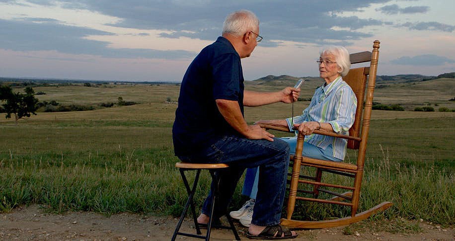 Over 14 years, Jim Puppe traveled across North Dakota, collecting tales from residents of every town, which led to his book “Dakota Attitude.” Above, he interviewed Pauline Koch Roll, from tiny Heil, who gave birth to 21 children in 21 years, the last in 1971. For Pauline, big families are a blessing. “Well, see, I come from a big family , so it really didn’t bother me that it’s too much work.”
(Courtesy Photo/Jesse Knutson)