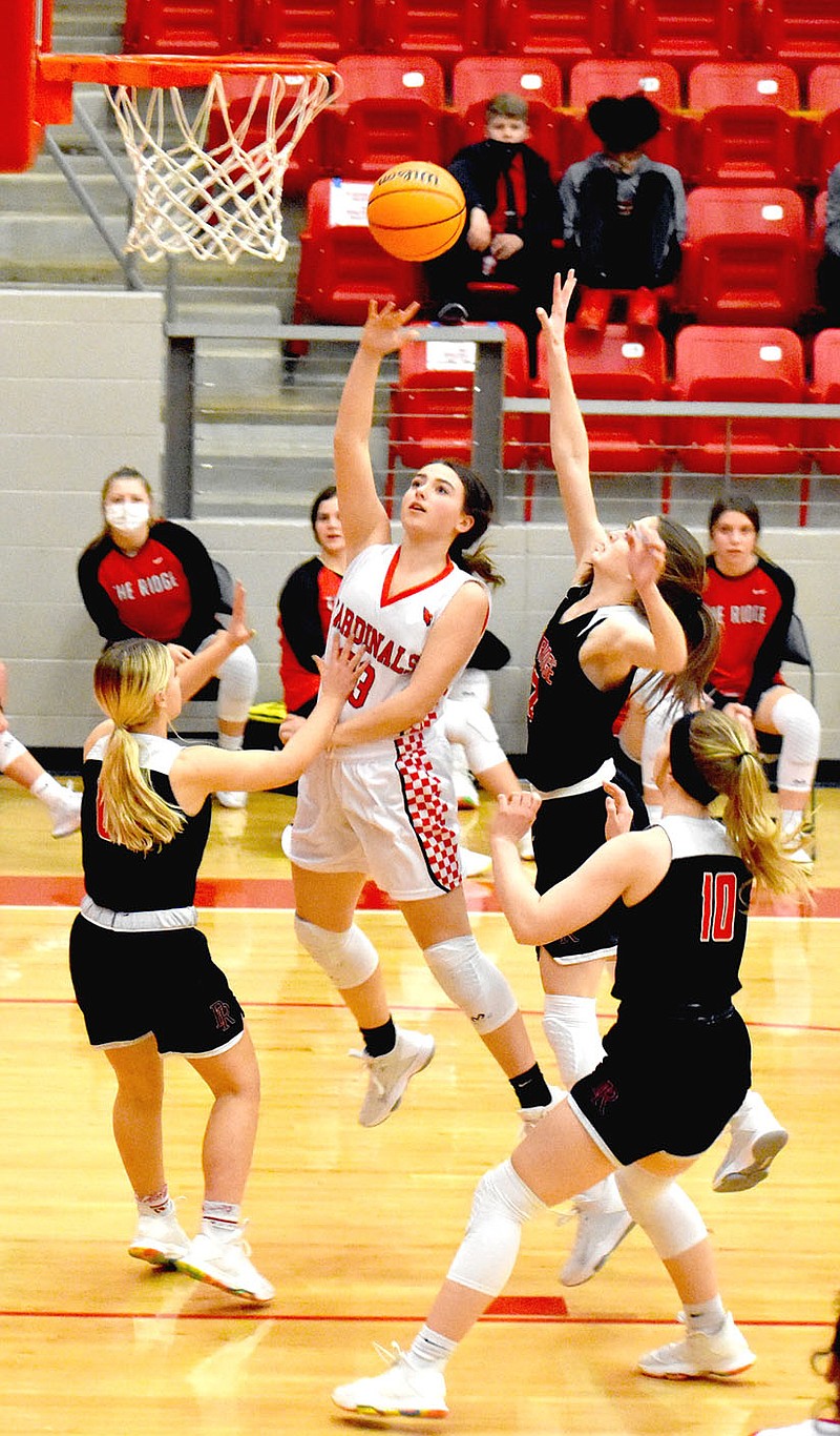 MARK HUMPHREY  ENTERPRISE-LEADER/Farmington senior Trinity Johnson, shown shooting a layup against Pea Ridge, hit a 3-pointer in the fourth quarter, but the Lady Cardinals couldn't catch up and lost 56-42 at Harrison on Friday, Jan. 8.
