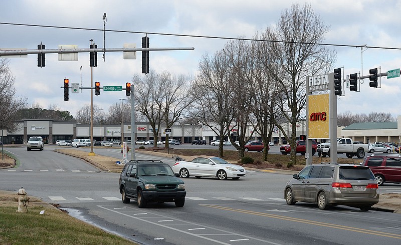 Traffic flows Friday through the intersection of Rolling Hills Drive and College Avenue in Fayetteville. The city has conceptual designs that place a roundabout in the parking lot of the shopping center, connecting Rolling Hills Drive, Appleby Road and Plainview Avenue. Visit nwaonline.com/210110Daily/ for today's photo gallery. 
(NWA Democrat-Gazette/Andy Shupe)
