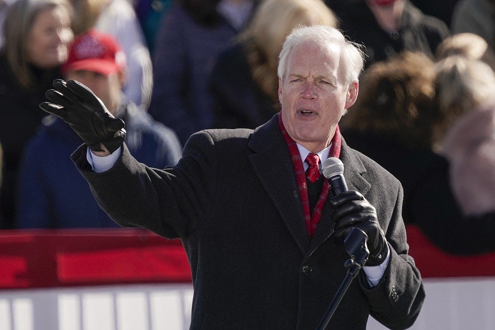 FILE - In this Oct. 30, 2020 file photo, Sen. Ron Johnson, R-Wis, speaks before President Donald Trump at a campaign rally, at the Austin Straubel Airport in Green Bay, Wis. Sen. Johnson says he has not made a decision yet on his political future as the vocal backer of President Donald Trump faces two years in the minority and mounting calls for him to step aside. Johnson texted The Associated Press on Thursday, Jan. 7, 2021, to say he had not yet made a decision. (AP Photo/Morry Gash, File)