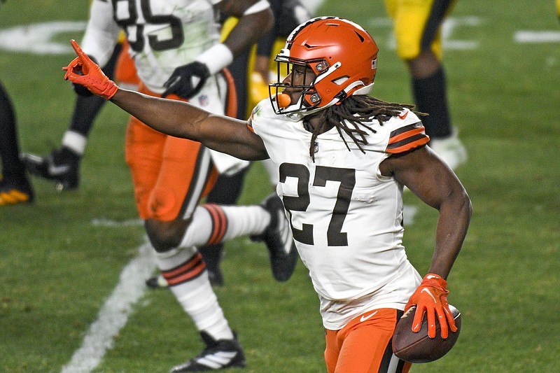 Cleveland Browns running back Kareem Hunt (27) celebrates after scoring on an eight-yard run during the first half of an NFL wild-card playoff football game against the Pittsburgh Steelers in Pittsburgh, Sunday, Jan. 10, 2021. (AP Photo/Don Wright)