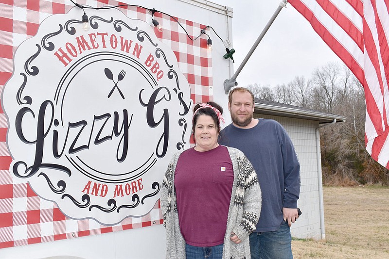 RACHEL DICKERSON/MCDONALD COUNTY PRESS Elizabeth and Joshua Grammer of Pineville are owners of Lizzy G's Hometown BBQ and More. The food truck can be found on Thursdays at Southern Roots Hair and Massage Boutique in Anderson.