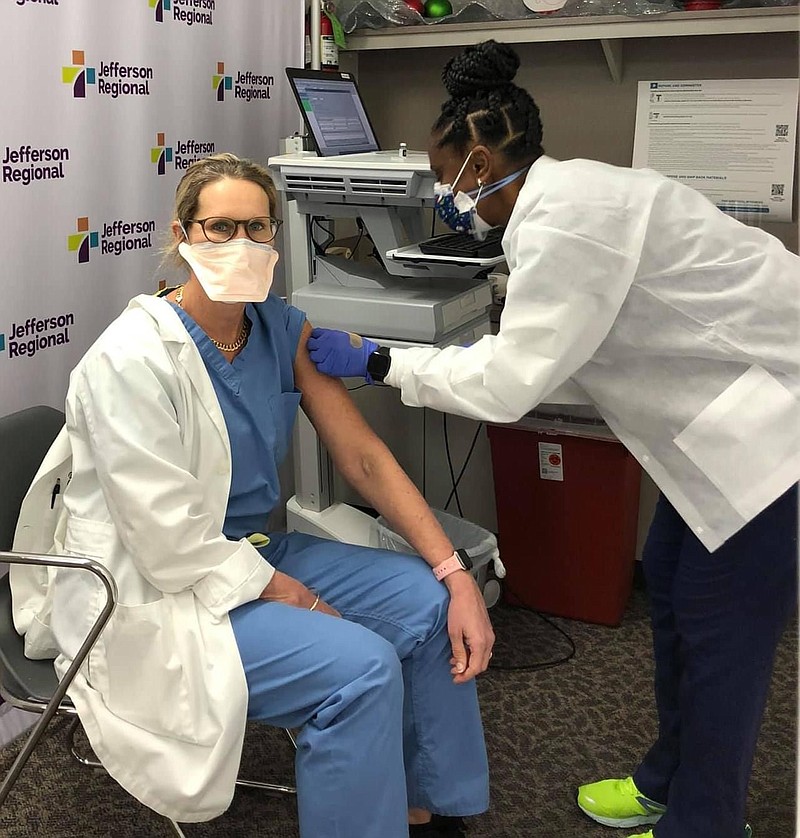 Jefferson Regional will set up an online site where people who fall into Phase 1B can get on a waiting list for receiving the covid-19 vaccine. Shown here is Dr. Amy Cahill, the hospital's chief of staff, receiving a vaccine from Tena Brooks, a licensed practical nurse. (Submitted photo)