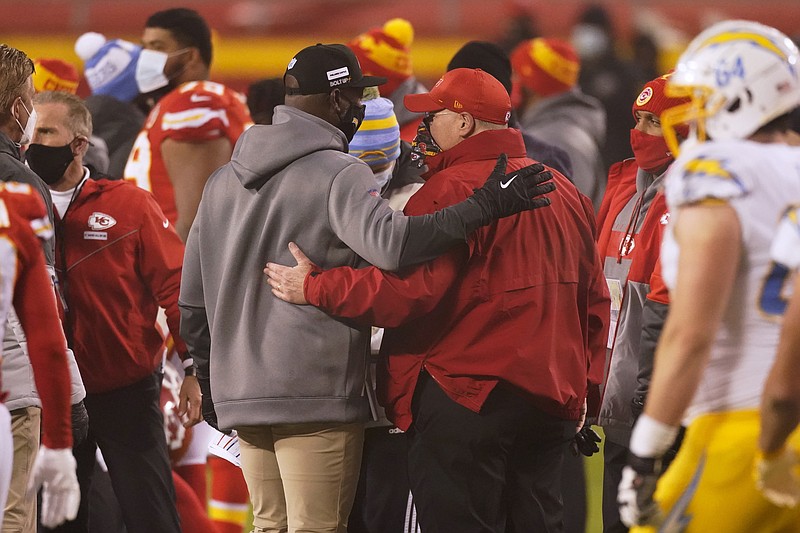 Los Angeles Chargers head coach Anthony Lynn, left, talks with Kansas City Chiefs head coach Andy Reid after an NFL football game, Sunday, Jan. 3, 2021, in Kansas City. The Chargers won 38-21. (AP Photo/Charlie Riedel)