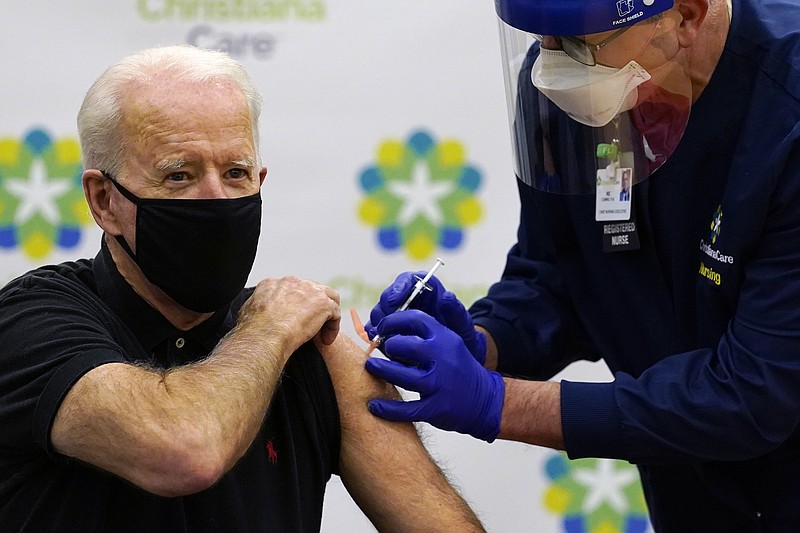 President-elect Joe Biden receives his second dose of the coronavirus vaccine at ChristianaCare Christiana Hospital in Newark, Del., Monday. The vaccine is being administered by Chief Nurse Executive Ric Cuming. - AP Photo/Susan Walsh