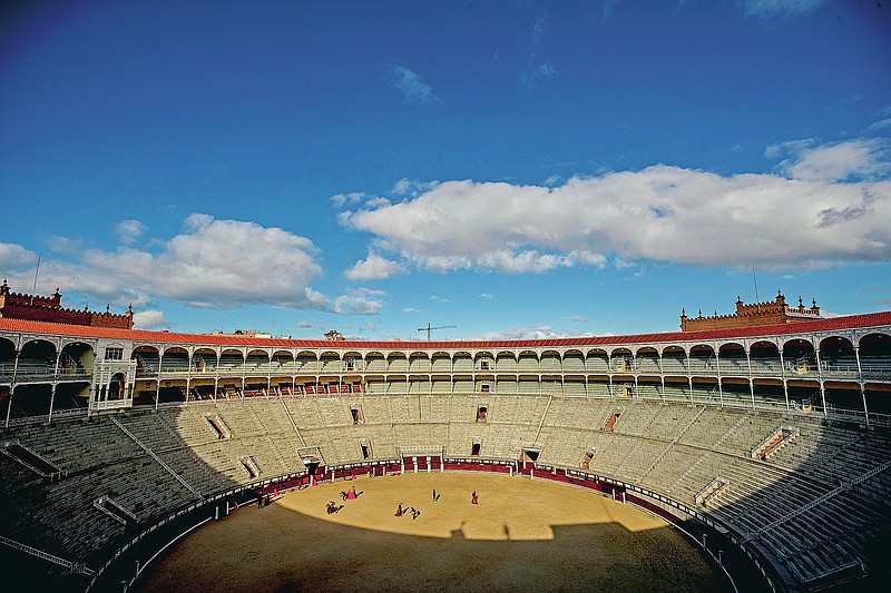 Pupils perform with their capes at the Bullfighting School at Las Ventas bullring in Madrid, Spain, Tuesday, Dec. 29, 2020. Las Ventas is one of the most prized venues in bullfighting, and a privileged place for its pupils to learn. The school was closed from March to August when Spain went into one of the world's strictest confinements to stem the spread of the COVID-19 pandemic. (AP Photo/Manu Fernandez)