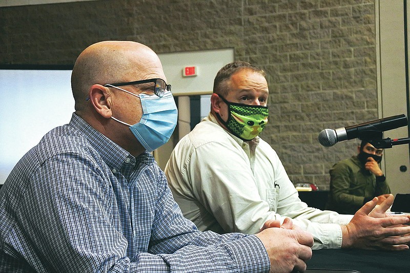 Matthew Hicks, director of the Sebastian County Health Unit, right, speaks while Sebastian County Emergency Management Director Kendall Beam, left, listens during the Fort Smith Board of Directors study session Tuesday, Jan. 12, 2021. 
(Thomas Saccente/Northwest Arkansas Democrat-Gazette)