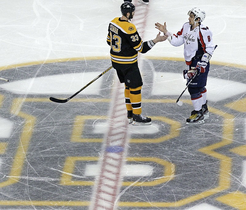 Boston Bruins defenseman Zdeno Chara (33) congratulates Washington Capitals left wing Alex Ovechkin (8) after the Capitals' 2-1 overtime win in Game 7 of an NHL Stanley Cup first-round playoff series in Boston on April 25, 2012. Ovechkin goes into the final year of his contract with the Capitals looking to win the Stanley Cup for the second time. He’ll have 43-year-old past champion Zdeno Chara with him but not Henrik Lundqvist chasing his first title, after tests showed the veteran goaltender couldn’t keep playing because of a heart condition. - Photo by Charles Krupa of The Associated Press story.lead_photo.caption