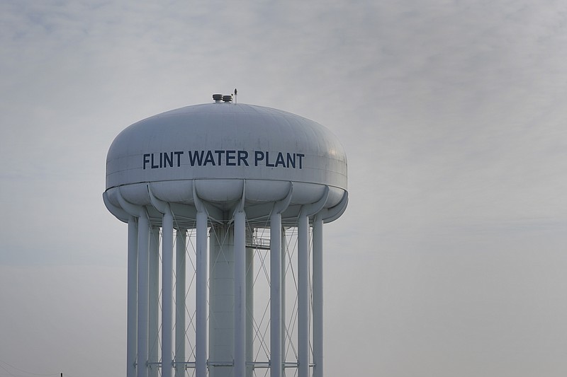 The Flint Water Plant tower is shown in Flint, Mich., Wednesday, Jan. 13, 2021. Some Flint residents impacted by months of lead-tainted water are looking past expected charges against former Gov. Rick Snyder and others in his administration to healing physical and emotional damages left by the crisis. (AP Photo/Paul Sancya) story.lead_photo.caption
