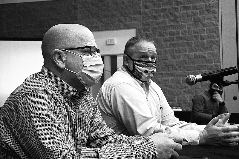 Matthew Hicks, director of the Sebastian County Health Unit, right, speaks while Sebastian County Emergency Management Director Kendall Beam, left, listens during the Fort Smith Board of Directors study session Tuesday, Jan. 12, 2021. 
(Thomas Saccente/Northwest Arkansas Democrat-Gazette)