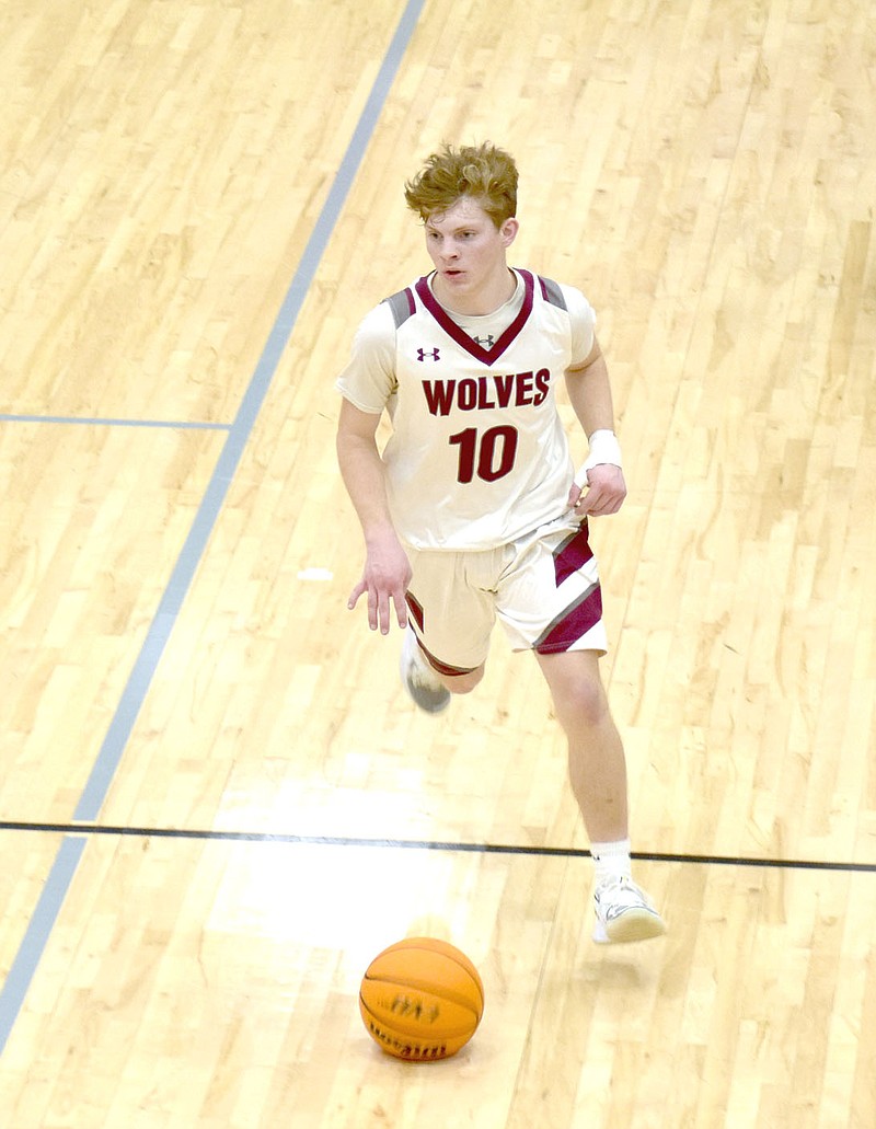MARK HUMPHREY  ENTERPRISE-LEADER/Lincoln senior Weston Massey scored 31 points making 5-of-9 shots from 3-point range during the Wolves' 69-34 boys basketball win in 3A-1 Conference play at Wolfpack Arena on Friday, Jan. 8. Because he's a threat to score that opens things up for teammates such as Daytin Davis, who broke loose for 32 points in a 63-62 win over West Fork on Tuesday, Jan. 12