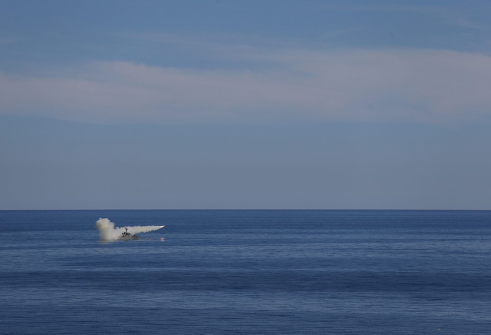 In this image released Thursday, Jan. 14, 2021, by the Iranian Army, a missile is launched from a warship during a naval drill. Iran fired cruise missiles Thursday as part of the drill in the Gulf of Oman, state media reported, amid heightened tensions with the U.S. (Iranian Army via AP)