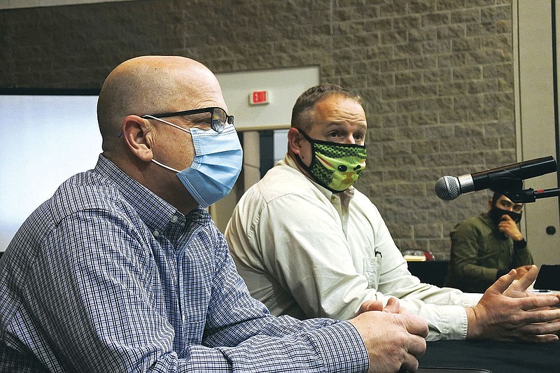 Matthew Hicks, director of the Sebastian County Health Unit, right, speaks while Sebastian County Emergency Management Director Kendall Beam, left, listens during the Fort Smith Board of Directors study session Tuesday, Jan. 12, 2021. 
(Thomas Saccente/Northwest Arkansas Democrat-Gazette)