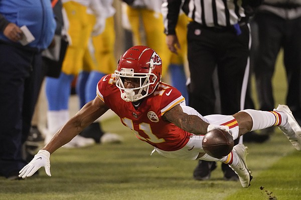 Kansas City Chiefs wide receiver Tyreek Hill (10) dives to try and