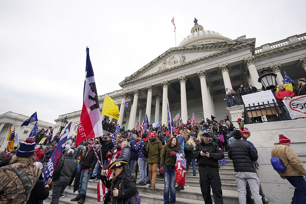 FILE - In this Wednesday, Jan. 6, 2021 file photo, Donald Trump supporters gather outside the Capitol in Washington. (AP Photo/Manuel Balce Ceneta, File)