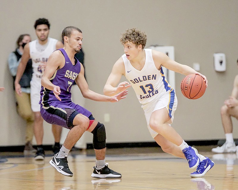 Photo courtesy of JBU Sports Information
John Brown freshman Noah Taylor, right, drives to the basket against Southwestern Assemblies of God (Texas) on Saturday in the Golden Eagles' 75-72 loss. Taylor scored 21 points, including six 3-pointers.