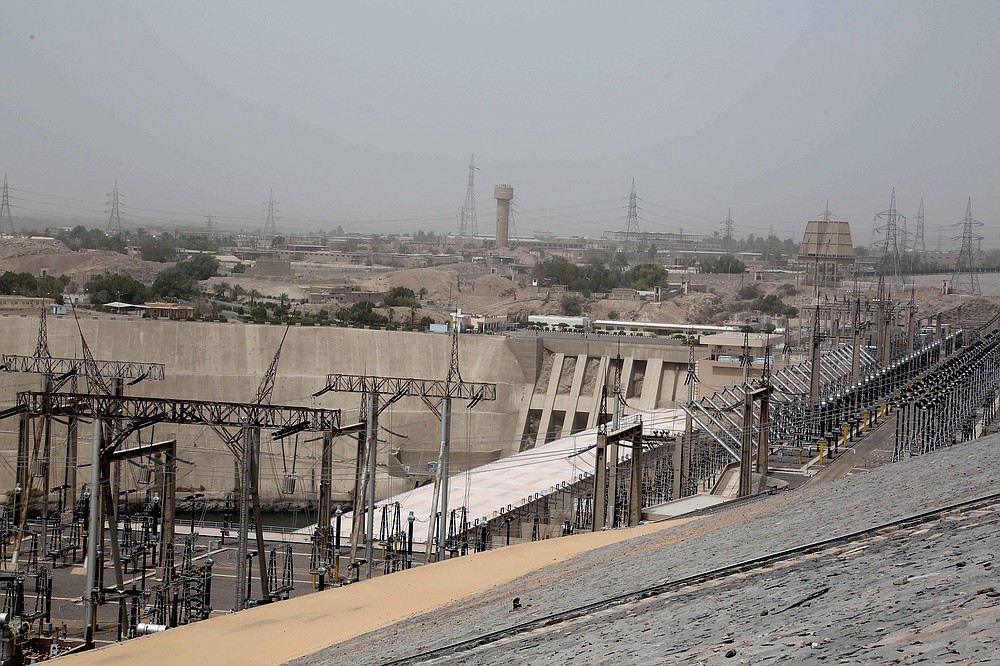 FILE - this May 7 , 2018 file photo, shows the high dam in Aswan, Egypt. Egyptians are marking 50 years since the inauguration of the Nile dam, a massive feat of construction that has shaped the course of modern-day Egypt. It spared it from seasonal droughts and flooding, and generated electricity, but it also displaced members of the country's Nubian minority and had a lasting environmental impact on the region. (AP Photo/Nariman El-Mofty, File)