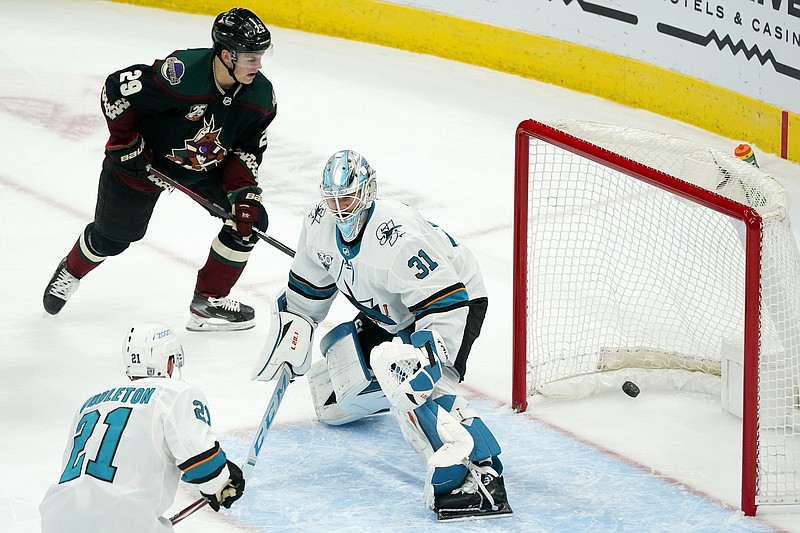 San Jose Sharks goaltender Martin Jones (31) gives up a goal to Arizona Coyotes' Phil Kessel during the first period of Saturday's game in Glendale, Ariz. - Photo by Ross D. Franklin of The Associated Press