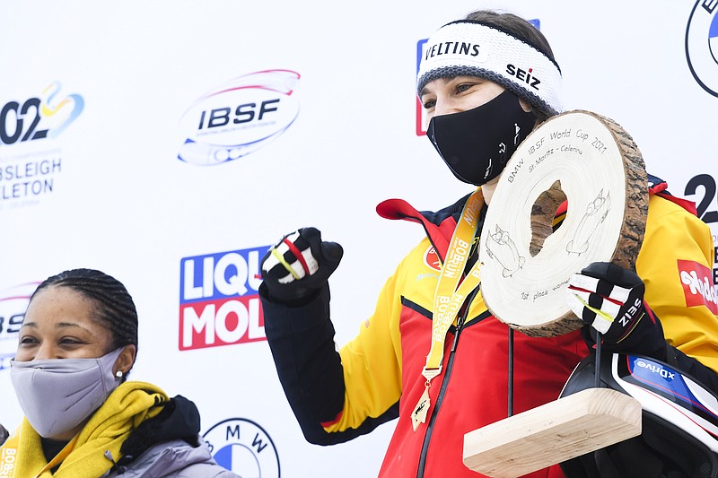 Second placed Elana Meyers Taylor of USA, left, and Winner Stephanie Schneider of Germany during the women's 2-bob World Cup in St. Moritz, Switzerland, on Sunday, January 17, 2021. (Gian Ehrenzeller/Keystone via AP)