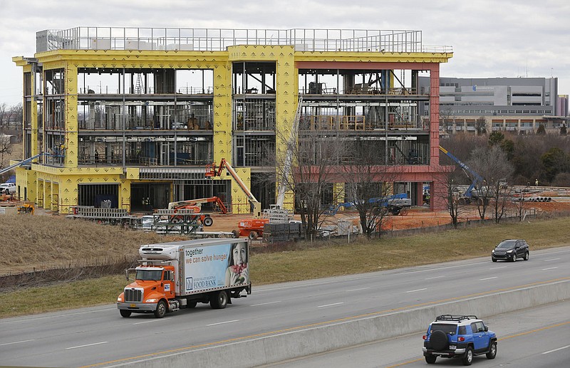 The construction of a new Arkansas Blue Cross and Blue Shield 81,000-square-foot building is visible Thursday, January 14, 2021, near the intersection of I-49 and Don Tyson Parkway in Springdale. Check out nwaonline.com/210117Daily/ and nwadg.com/photos for a photo gallery.
(NWA Democrat-Gazette/David Gottschalk)