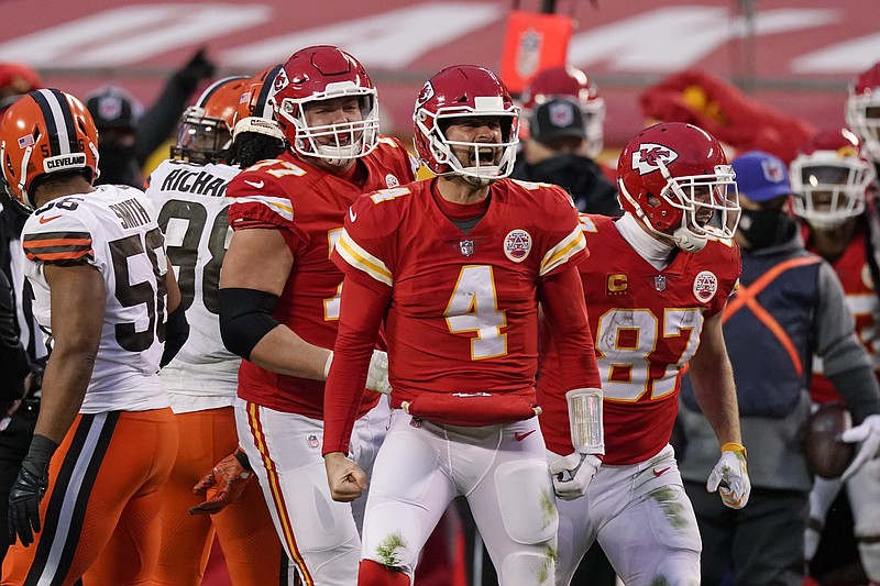 Kansas City Chiefs quarterback Chad Henne celebrates after a run during the second half of an NFL divisional round football game against the Cleveland Browns, Sunday, Jan. 17, 2021, in Kansas City. (AP Photo/Charlie Riedel)