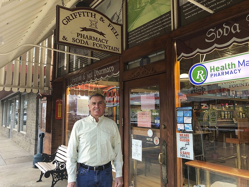 Ric Griffith poses for a portrait outside a pharmacy he owns Friday, Jan. 15, 2021, in Kenova, W.Va. Griffith & Feil is among 250 mom-and-pop pharmacies in West Virginia helping to vaccinate residents in the quest to banish the coronavirus pandemic. (AP Photo/John Raby)