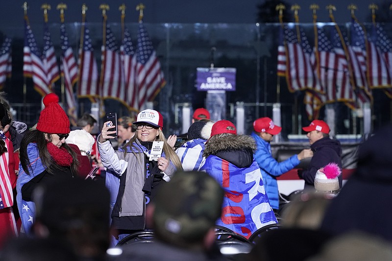 FILE - In this Jan. 6, 2021 file photo people arrive to attend a rally in support of President Donald Trump. An AP review of records finds that members of President Donald Trump’s failed campaign were key players in the Washington rally that spawned a deadly assault on the U.S. Capitol last week.(AP Photo/Jacquelyn Martin, File)