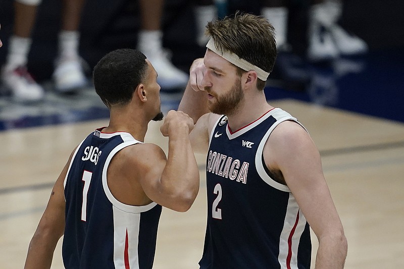 Gonzaga guard Jalen Suggs (1) celebrates with forward Drew Timme (2) during the second half of the team's NCAA college basketball game against Saint Mary's in Moraga, Calif., Saturday, Jan. 16, 2021. (AP Photo/Jeff Chiu)