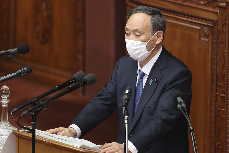 Japanese Prime Minister Yoshihide Suga delivers a policy speech during an ordinary Diet session at the upper house of parliament in Tokyo, Monday, Jan. 18, 2021. (AP Photo/Koji Sasahara)