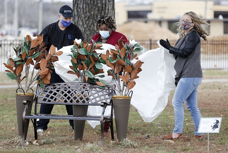 Mayor Doug Sprouse (from left), Alice Gachuzo-Colin, founder UNITY Love Creation, and Megan Godfrey, State Representative 89th District, unveiled Monday a memorial bench and plaque to Martin Luther King Jr. at Luther George Park in Springdale. The UNITY Love Creation group in Springdale dedicated a bench and plaque at Luther George Park as part of an online Martin Luther King Jr. Day event. Check out nwaonline.com/210119Daily/ and nwadg.com/photos for a photo gallery.
(NWA Democrat-Gazette/David Gottschalk)