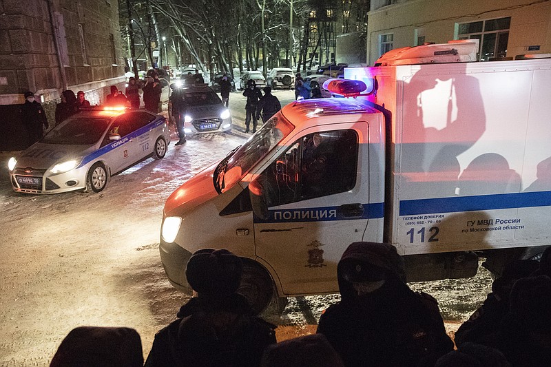 A prison truck carrying Russian opposition leader Alexei Navalny leaves a police precinct after a court hearing in Moscow, Russia, Monday, Jan. 18, 2021. A judge has ordered for Alexei Navalny to be held in custody for 30 days, his spokeswoman Kira Yarmysh said on Twitter. The ruling Monday concluded an hours-long court hearing set up at a police precinct where the politician has been held since his arrest at a Moscow airport Sunday. (AP Photo/Pavel Golovkin)