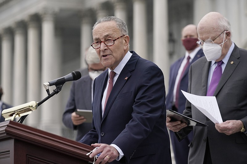 FILE - In this Oct. 22, 2020, file photo Senate Minority Leader Chuck Schumer, D-N.Y., and Democratic members of the Senate Judiciary Committee hold a news conference after boycotting the vote by the Republican-led panel to advance the nomination of Judge Amy Coney Barrett to sit on the Supreme Court at the Capitol in Washington. Schumer, will be majority leader once the two new Georgia senators and Vice President-elect Kamala Harris are all sworn into office, and will have the opportunity to bring legislation to the floor and force votes. (AP Photo/J. Scott Applewhite, File)