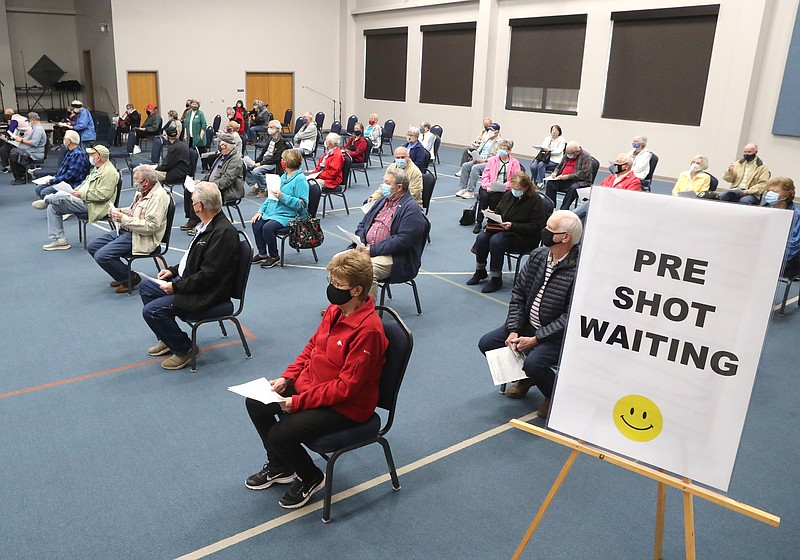 People are seated in a socially distanced fashion as they wait to get vaccinated Wednesday during a vaccination clinic at Balboa Baptist Church. - Richard Rasmussen of The Sentinel-Record