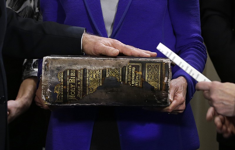 Vice President Joe Biden (left) places his hand on the Biden family Bible held by his wife, Jill Biden (center), as he takes the oath of office from Supreme Court Justice Sonia Sotomayor (right) during an official ceremony at the Naval Observatory in Washington. While many presidents have used Bibles for their inaugurations, the Constitution does not require the use of a specific text and specifies only the wording of president’s oath. That wording also doesn’t include the phrase “so help me God,” but every modern president has appended it to their oaths and most have chosen symbolically resonant Bibles for their inaugurations.
(AP/Carolyn Kaster)