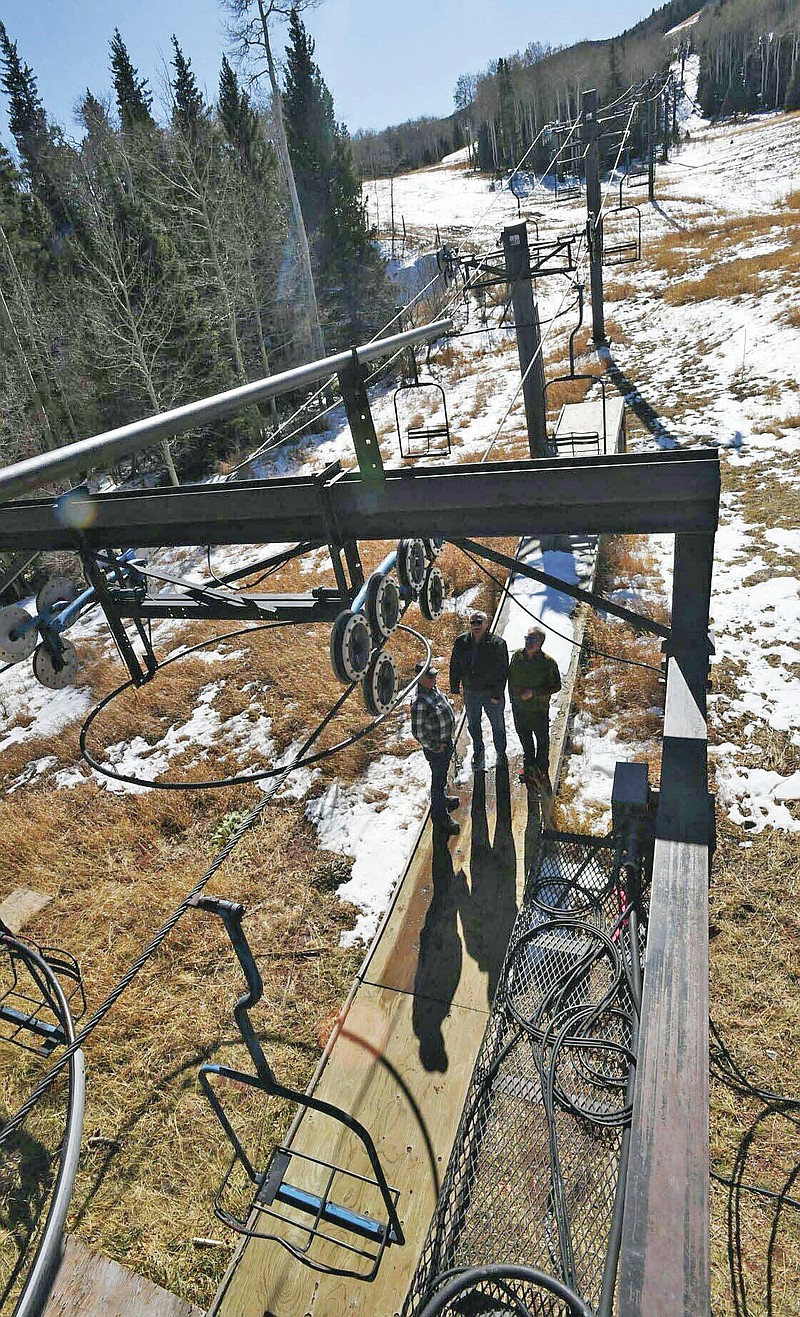 A light coating of snow covers Cuchara Mountain Park ski resort on November 2019, in Cuchara, Colo. Although the lifts aren't operational, skiers, snowboarders and sledders can hike up the slopes and take advantage of the old runs. Now the grounds are in the hands of Huerfano County. Sledding and cross-country skiing on a groomed loop have been popular this winter, overseers say, following a busy summer for Cuchara Mountain Park’s disc golf and mini golf courses. (Jerilee Bennett/The Gazette via AP)