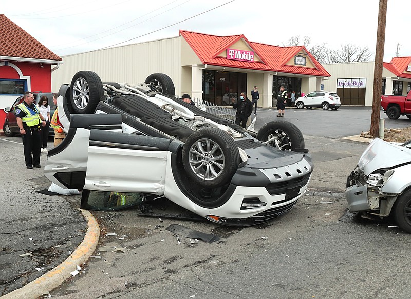 The 3800 block of Central Avenue near Cornerstone Market Place was blocked Thursday afternoon as emergency personnel worked to clear the scene of a two-vehicle collision. - Photo by Richard Rasmussen of The Sentinel-Record