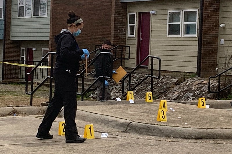 Hot Springs police work the scene of a shooting that occurred at around 4 p.m. Thursday in the 700 block of Spring Street. - Photo by Cassidy Kendall of The Sentinel-Record