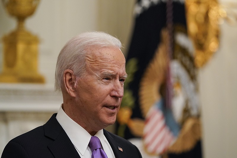 President Joe Biden speaks about the coronavirus in the State Dinning Room of the White House, Thursday, Jan. 21, 2021, in Washington. (AP Photo/Alex Brandon)