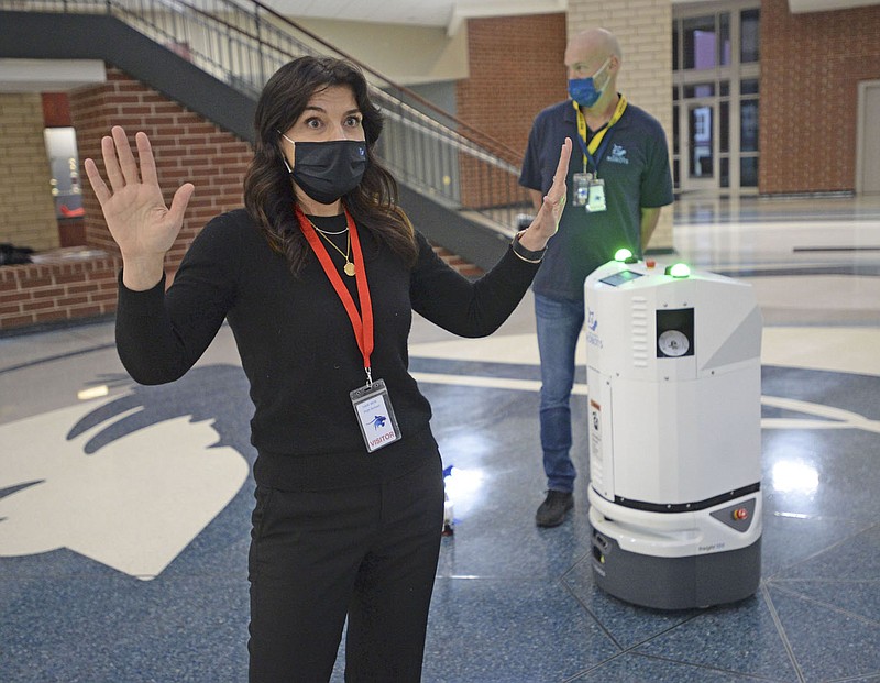Kimberly Corbitt, head of customer engagement for Build With Robots, speaks Thursday about Breezy One, a sanitizing robot made by her company, at Har-Ber High School in Springdale. The School District would be the first in the state to employ the robot that works to sanitize a 100,000-square-foot building in less than two hours while it’s unoccupied and is 99 percent affective at eliminating viruses and bacteria according to the manufacturer. School District representatives were given a demonstration of its use as they contemplate its purchase. Go to nwaonline.com/210122Daily/ for today’s photo gallery.
(NWA Democrat-Gazette/Andy Shupe)