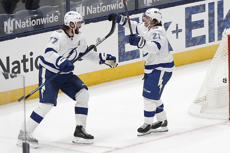 Tampa Bay Lightning's Brayden Point, right, celebrates his goal against the Columbus Blue Jackets with Victor Hedman in overtime of Thursday's game in Columbus, Ohio. - Photo by Jay LaPrete of The Associated Press