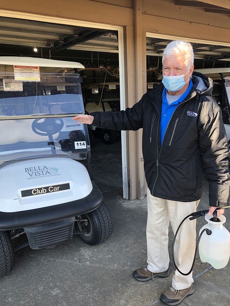 Rick Harvey/Special to the Weekly Vista
Tim Auge with the Bella Vista Country Club explains the process of disinfecting golf carts after each use.