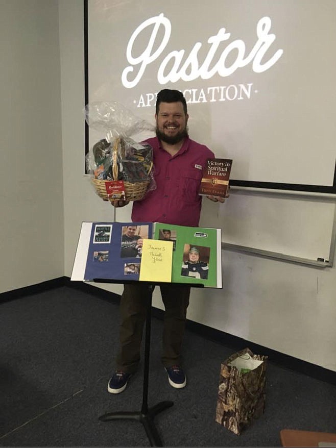 James Bryan receives gifts from his congregation to show they appreciate him as a pastor. (Courtesy Photo/Bethel Deaf Fellowship)