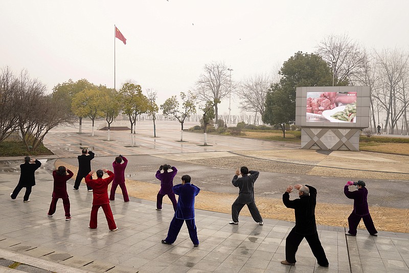 Residents practice tai chi at a park in Wuhan in central China's Hubei Province on Saturday, Jan. 23, 2021. A year after it was locked down to contain the spread of coronavirus, the central Chinese city of Wuhan has largely returned to normal, even as China continues to battle outbreaks elsewhere in the country. (AP Photo/Ng Han Guan)