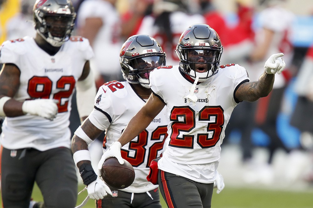 Tampa Bay Buccaneers' Sean Murphy-Bunting (23) celebrates after intercepting a pass intended for Green Bay Packers' Allen Lazard during the first half of the NFC championship NFL football game in Green Bay, Wis., Sunday, Jan. 24, 2021. (AP Photo/Matt Ludtke)